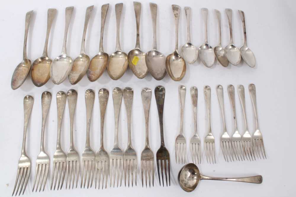 Composite set of early 19th century Old English pattern flatware, with armorial crest. 32 pieces.