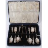 Composite set of six George V silver teaspoons, with two pairs sugar tongs in a fitted case