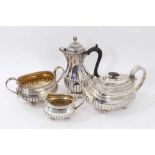 Georgian and Victorian silver three piece teaset, and a separate Victorian hot water jug