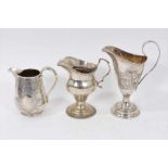 Victorian silver cream jug of baluster form and two others.