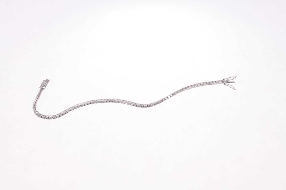 Diamond tennis bracelet with a line of brilliant cut diamonds in 18ct white gold setting. Estimated - Image 2 of 2