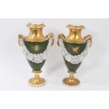 Pair of Paris porcelain vases, 19th century, decorated with swags of encrusted flowers on a green an
