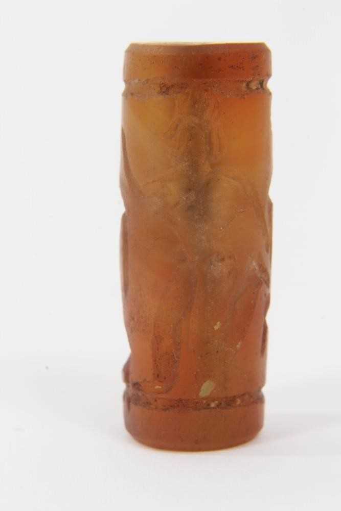 Ancient carved carnelian cylinder seal, Near Middle East, carved with figures, approximately 3.5cm l - Image 2 of 8