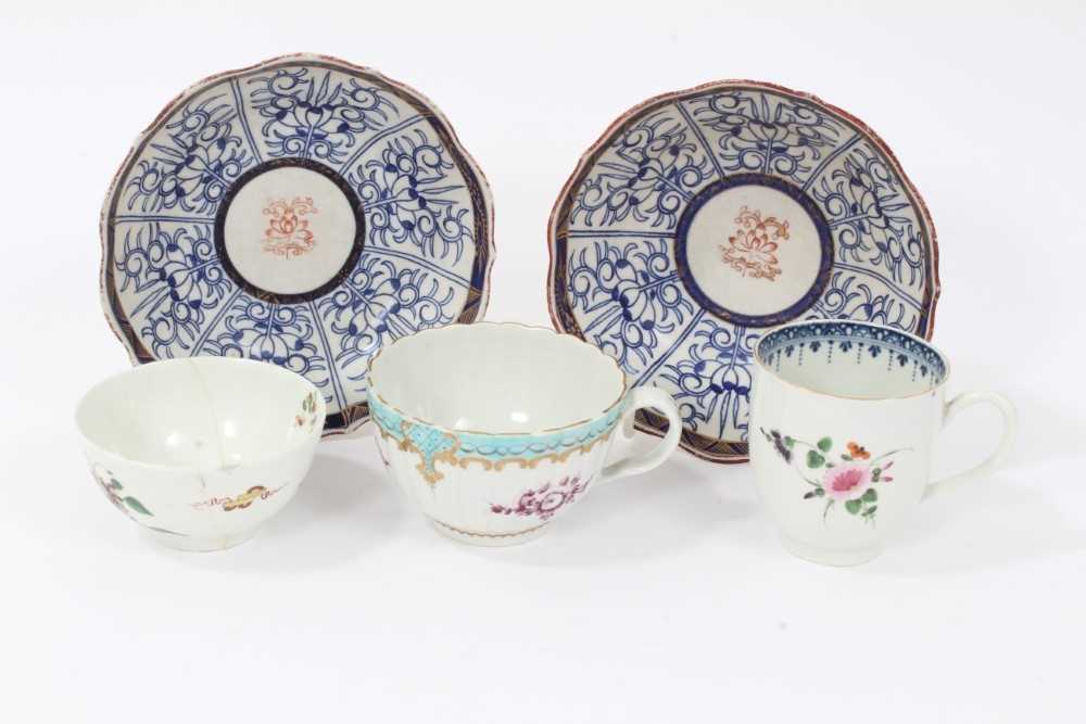 A Worcester coffee cup, a tea cup, a tea bowl in the Hibiscus pattern, and two Royal Lily pattern la