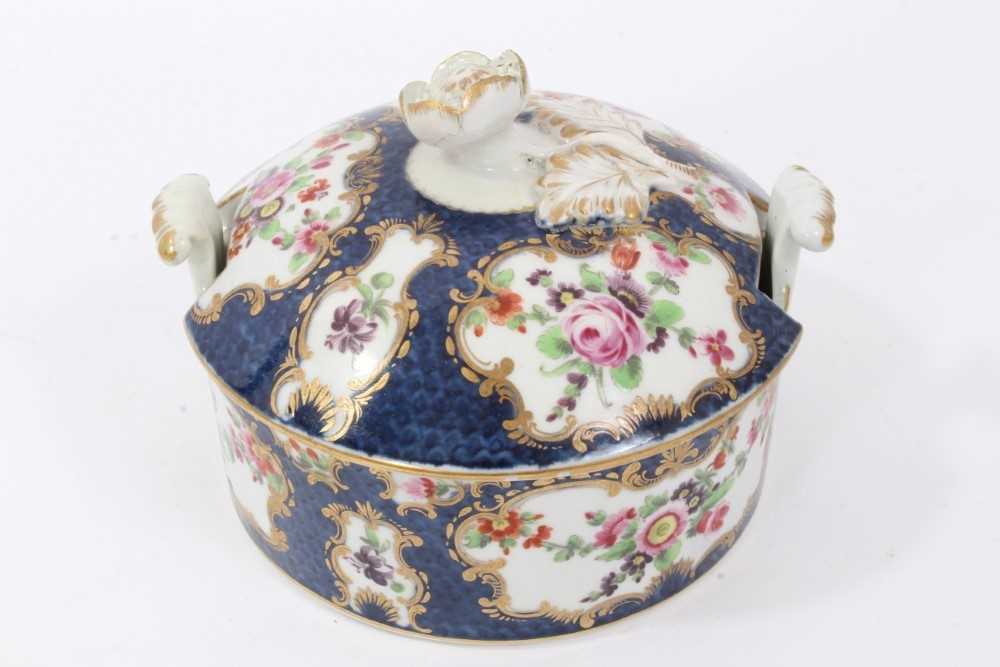 Worcester butter tub and cover, circa 1770, painted with flowers in gilt scrollwork panels, on a blu - Image 2 of 6