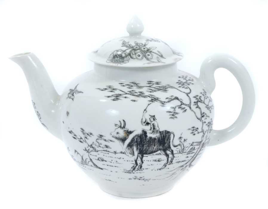 Worcester teapot and cover, circa 1755-56, decorated in monochrome black with the Boy on a Buffalo p