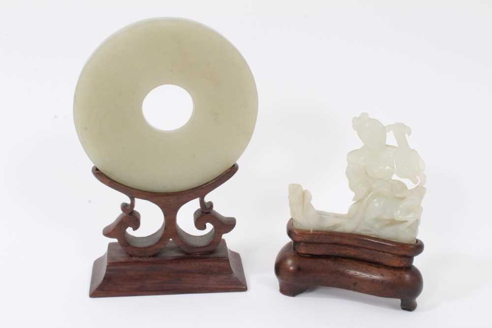 Good Chinese carved jade figure, together with a carved jade bi-disc