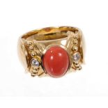 Coral and diamond dress ring, the wide 14ct yellow gold band with a central oval coral cabochon flan