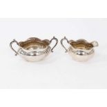 George V silver twin handled sugar bowl and matching cream jug