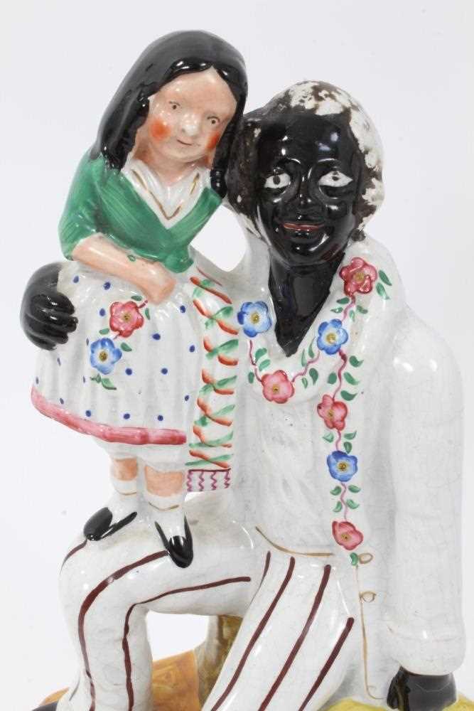Staffordshire pottery group of Uncle Tom and Little Eva - Image 3 of 5