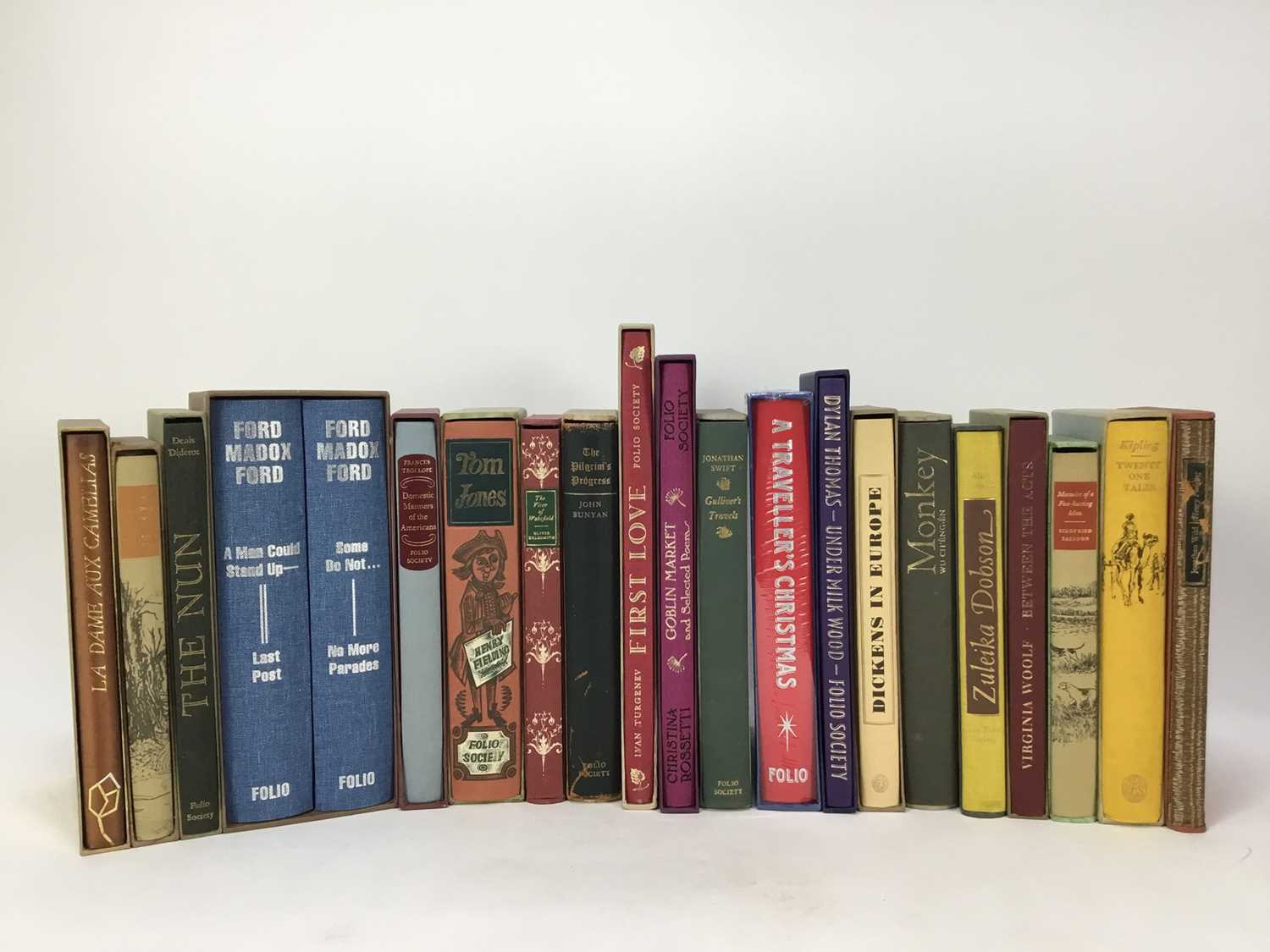 Twenty-one volumes of Folio Society books, including Wolfe, Trollope, Fielding, etc