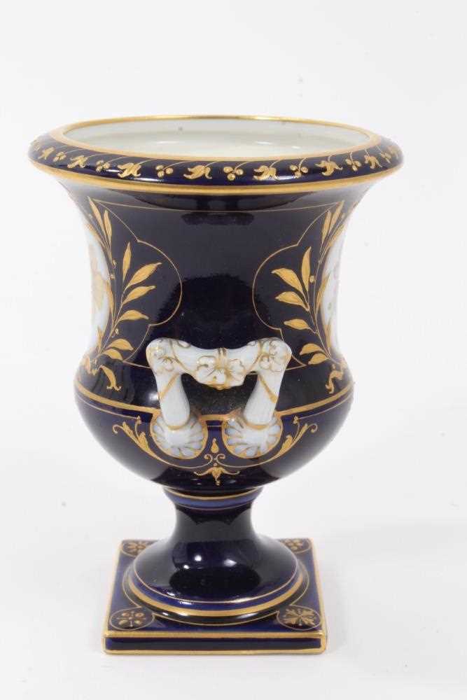 Small Berlin porcelain campana vase, circa 1880, painted with flowers on a gilt and cobalt blue grou - Image 4 of 7