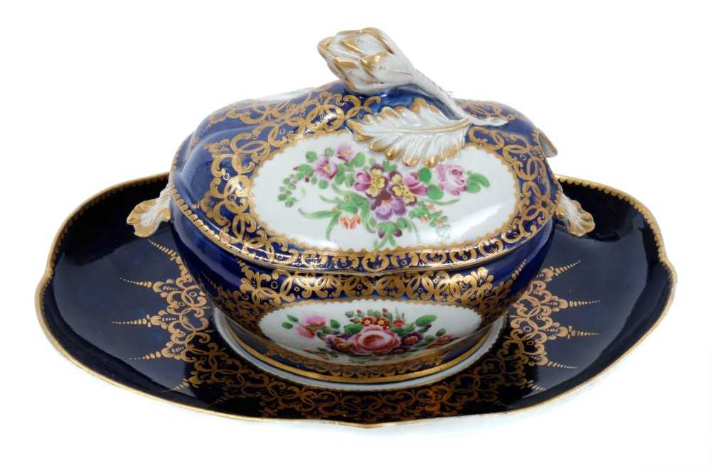 Worcester oval sauce tureen, cover and stand, circa 1772-75, polychrome painted with flowers on a co