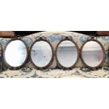 Rare set of four Regency oval gilt wall mirrors