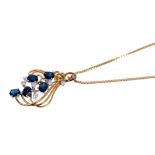 Sapphire and diamond cluster pendant with five oval mixed cut blue sapphires and six brilliant cut d