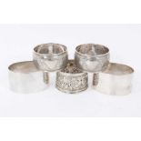 Two pairs of 20th century silver napkin rings and one other single Victorian silver napkin ring