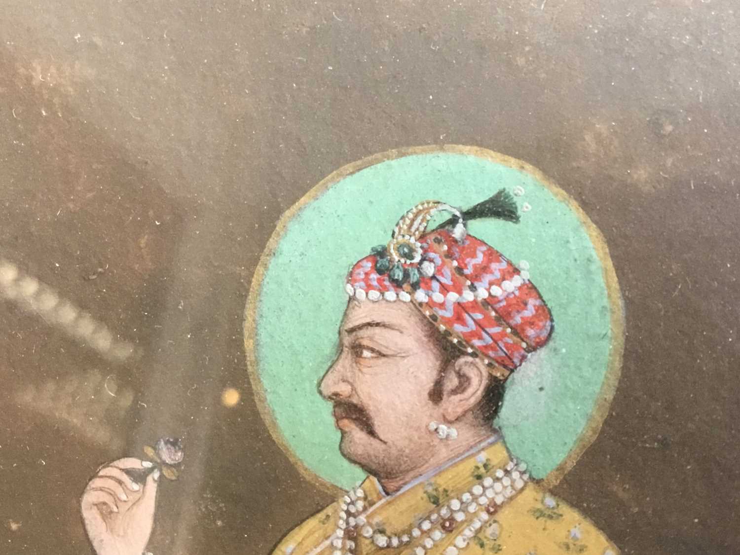Indian painting of a Jaipur nobleman In yellow embroidered robes, holding a rose, standing on a carp - Image 5 of 13