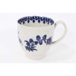 Liverpool blue and white coffee cup, circa 1775, decorated with flowers on the outside and a foliate