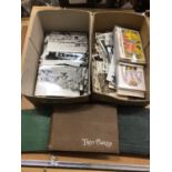 Two shoeboxes containing postcards, plus 3 albums of postcards, approximately 250