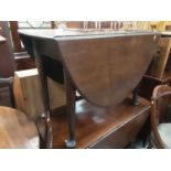 Georgian mahogany oval dropleaf dining table on taper legs and pad feet and Georgian wine table (2)
