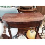 Regency mahogany card table with fold over top on turned legs