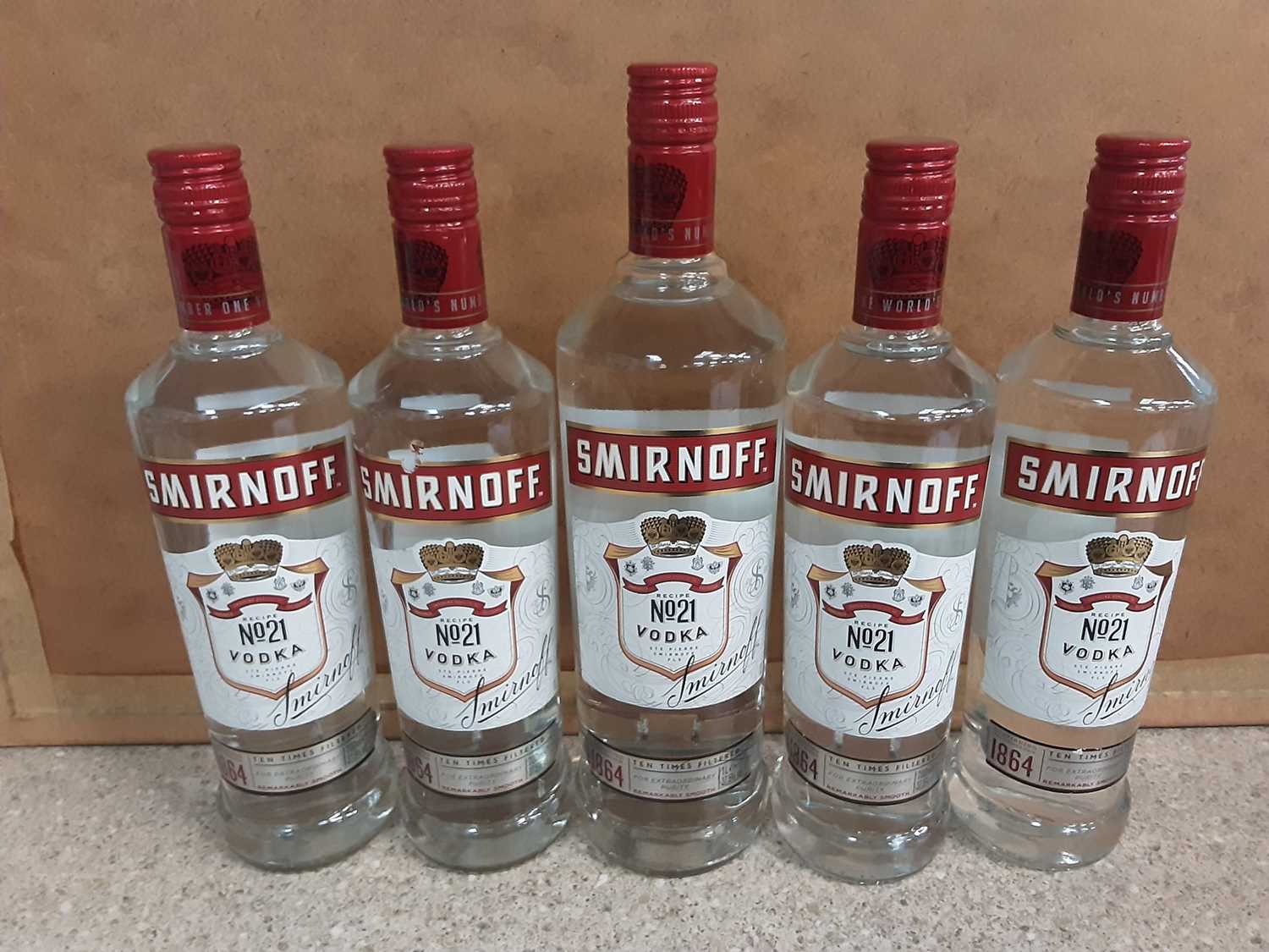 Four bottles of Smirnoff Vodka 70cl together with a 1 litre bottle (5)