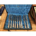 Set of twelve 19th century Continental white metal dinner knives with steel blades in fitted case