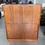 Mid century rosewood drinks cabinet on plinth base