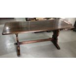 Good quality oak refectory table on pierced shaped end standards joined by stretcher