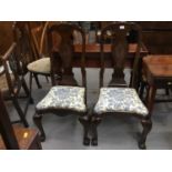 Set of four Dutch carved walnut chairs with drop in seats