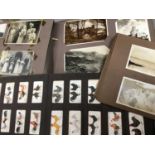 Album of cigarette cards, together with two albums of photographs and postcards