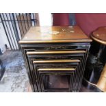 Oriental lacquered nest of four occasional tables decorated with flowers and birds