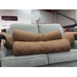Three cylindrical sofa cushions