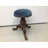 Victorian mahogany piano stool with blue upholstered seat on tripod base and a tiled top table and a