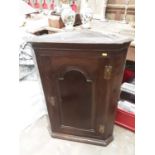 Two 18th century oak hanging corner cupboards and carved oak framed mirror