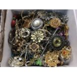 Box of costume jewellery including large collection of brooches and rings