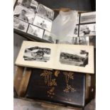 Oriental lacquered box, Oriental photograph album, and a postcard album containing approximately 20