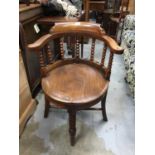 Late Victorian elm Captains chair with solid seat, bobbin turned supports joined by stretchers