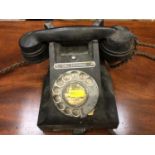A black Bakelite vintage telephone
