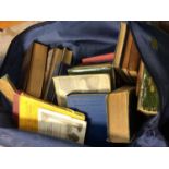 Three blue bags containing books