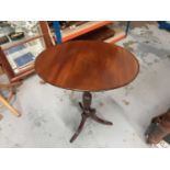 19th century mahogany oval wine table on reeded and turned tripod base