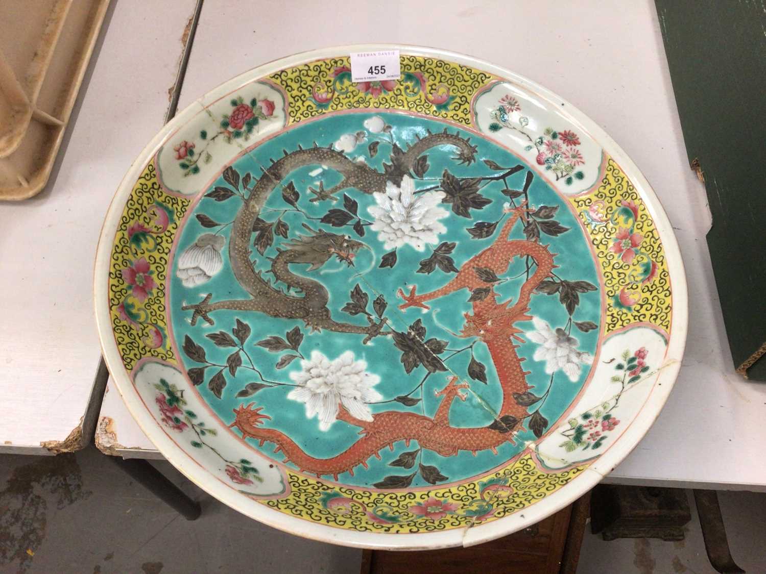 Chinese famille rose porcelain dish, c.1900, decorated with two dragons on a turquoise ground