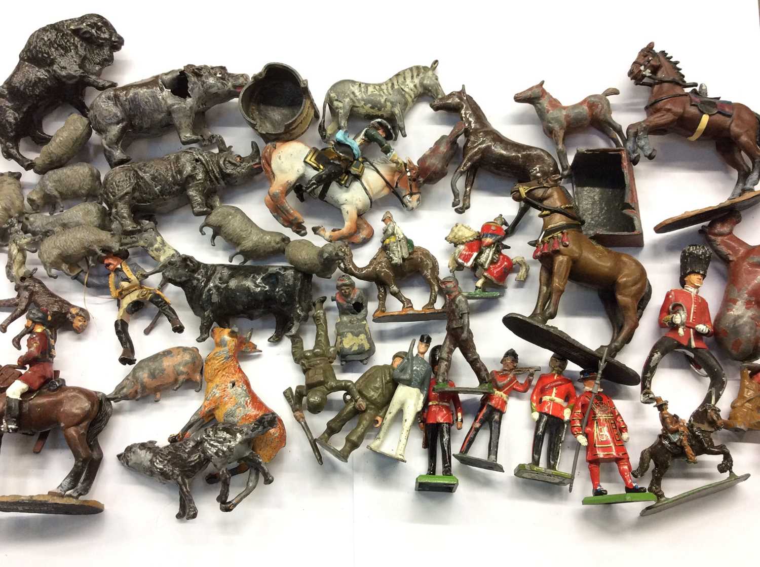 Box of lead soldiers, horses and farm animals