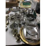 Group of silver plated ware to include a cocktail shaker, three piece tea set and other plated ware