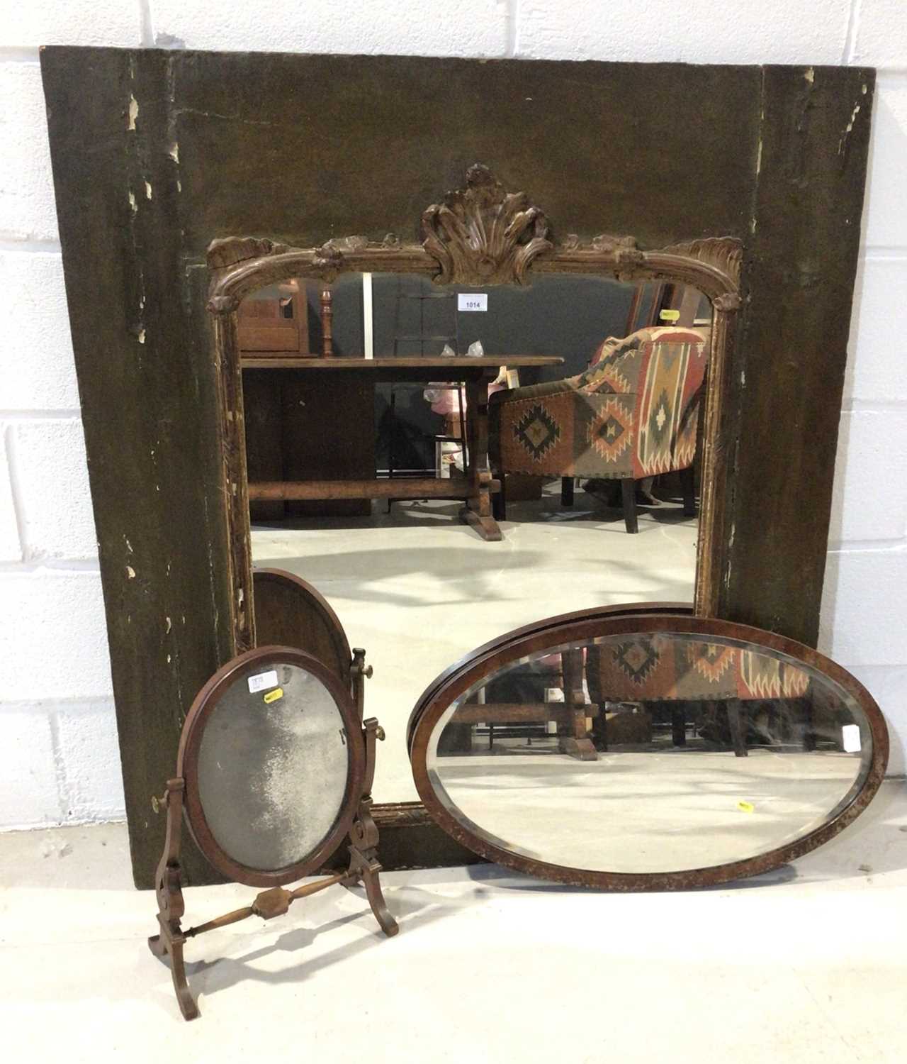 Mahogany swing frame toilet mirror, oval bevelled wall mirror and one other large wall mirror.