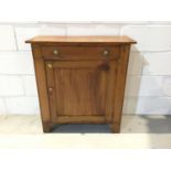 Old pine cupboard with single drawer and panelled door below on bracket feet