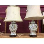 Pair of Chinese style table lamps on pierced wooden bases