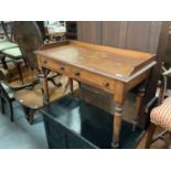 Two Victorian mahogany dwarf bookshelves and Victorian mahogany side table with two drawers on turne