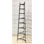 Wrought iron eight tier pot stand of triangular form