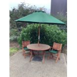 Garden set comprising folding table, four matching chairs with cushions, parasol and stand